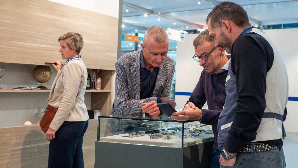 Visitors and exhibitors engaging in product discussions at SICAM 2025 in Pordenone – an international furniture exhibition, SICAM furniture fair, and leading SICAM trade show.